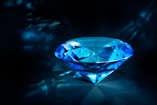 Shiny blue Diamond on a black background