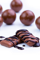 Chocolate candies on a white background.