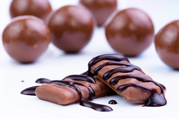 Chocolate candies on a white background.
