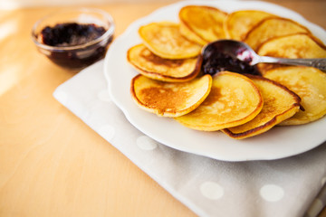 Pancakes with jam and spoon