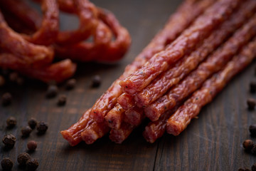 Sausage or kabanos and pepper on vintage wooden boards
