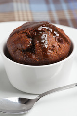 Fig pudding in a white ramekin.