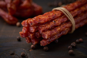 Sausage or kabanos and pepper on vintage wooden boards