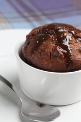 Fig pudding in a white ramekin.