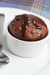 Fig pudding in a white ramekin.