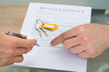 Person Signing Rental Contract
