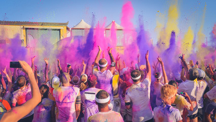 Celebrants dancing during the color Festival