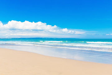 Fototapeta na wymiar Tropical beach and beautiful sea. Blue sky with clouds in the ba