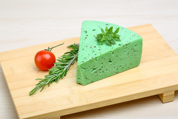 Green pesto cheese and basil leaves