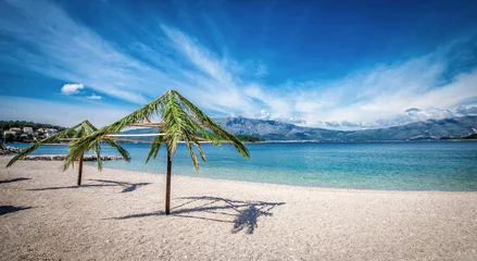 Fotobehang Palm umbrellas on beach in Croatia © Alen Ajan