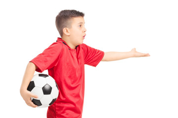 Junior football player gesturing displeasure isolated on white © Ljupco Smokovski