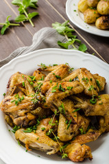 Roasted chicken wings with new potato
