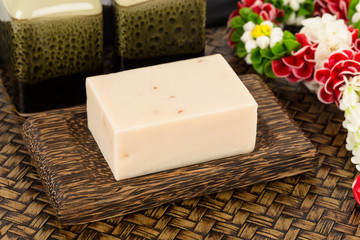 Hand made herbal soap in wooden dish