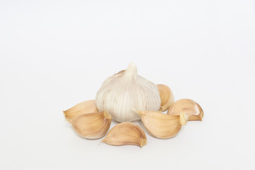 Bulbs of garlics on white background.