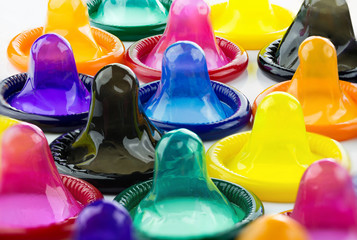 colorful condom on white background - obrazy, fototapety, plakaty