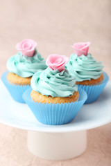 Tasty cupcake on pink background