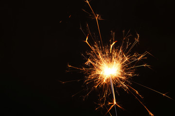 New year party sparkler on black background