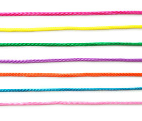 Colorful ropes on white background