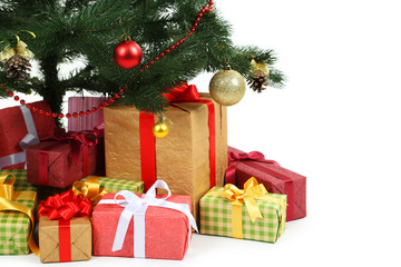 Decorated christmas tree with gifts on white background