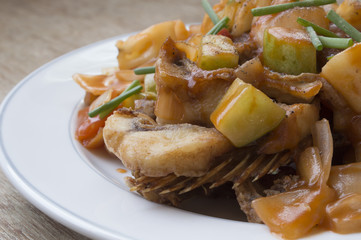 Close up Sweet and sour fish fried on white dish