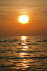 Fototapeta na wymiar Sunset on sea in portrait format