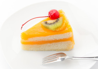 orange cake with kiwi and cherry