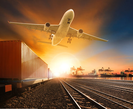 Fototapeta industry container trainst running on railways track plane cargo