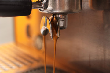 Coffee machine pouring coffee