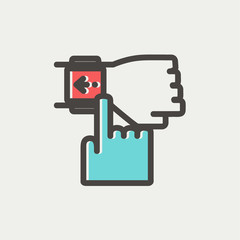 Smart watch pointing by finger thin line icon