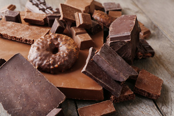 Set of chocolate on wooden table, closeup