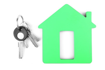 Keys with trinket on light background