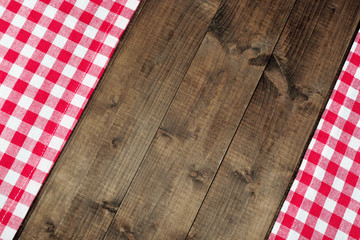 Checkered napkin on wooden table background