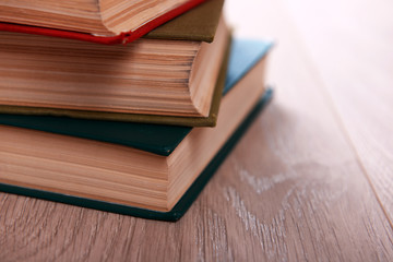 Stack of books on wooden background