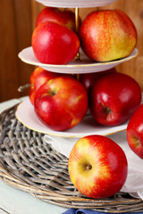 Tasty ripe apples on serving tray on table close up