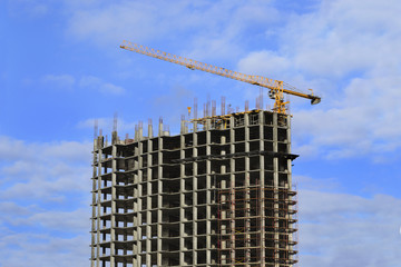 Naklejka premium High-rise building under construction and crane