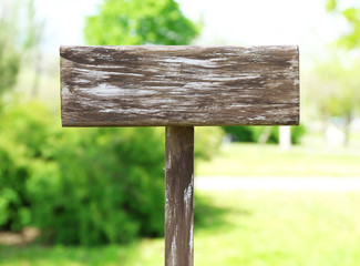Wooden signboard on nature background