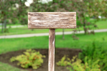 Wooden signboard on nature background