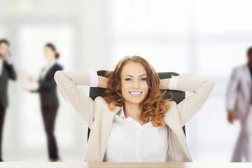 Businesswoman relaxing in office.