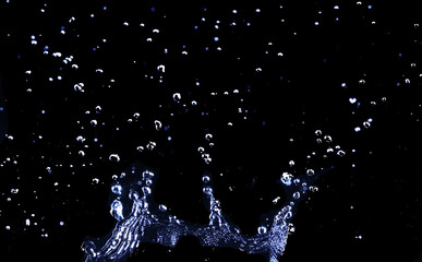 brilliant drops transparent water on black background