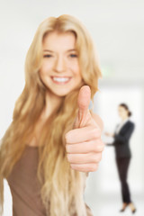 Student woman showing thumb up