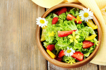 Light organic salad with flowers, close up