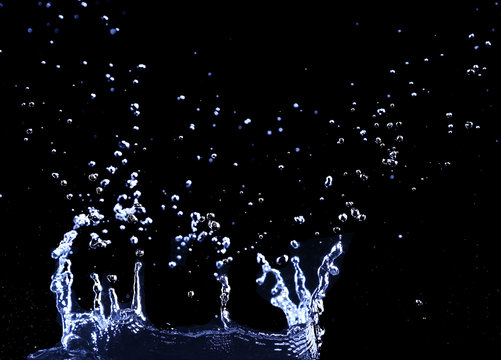 brilliant drops transparent water on black background