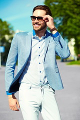 handsome stylish man in casual suit hipster cloth in the street