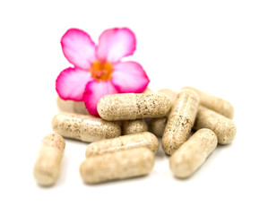 Herb capsules isolated on white background (Medical)