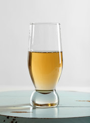 Glass of water on table on light background
