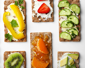 Tasty vegetarian sandwiches on white background