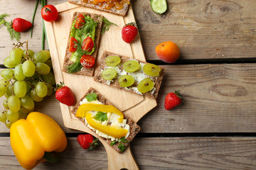 Still life with vegetarian sandwiches on wooden table