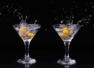 Vermouth cocktail inside martini glass over dark background