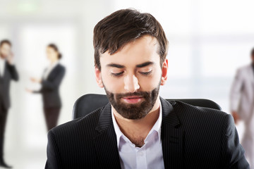 Businessman sitting at the desk.