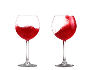 red wine splashing in a glass, isolated on white
